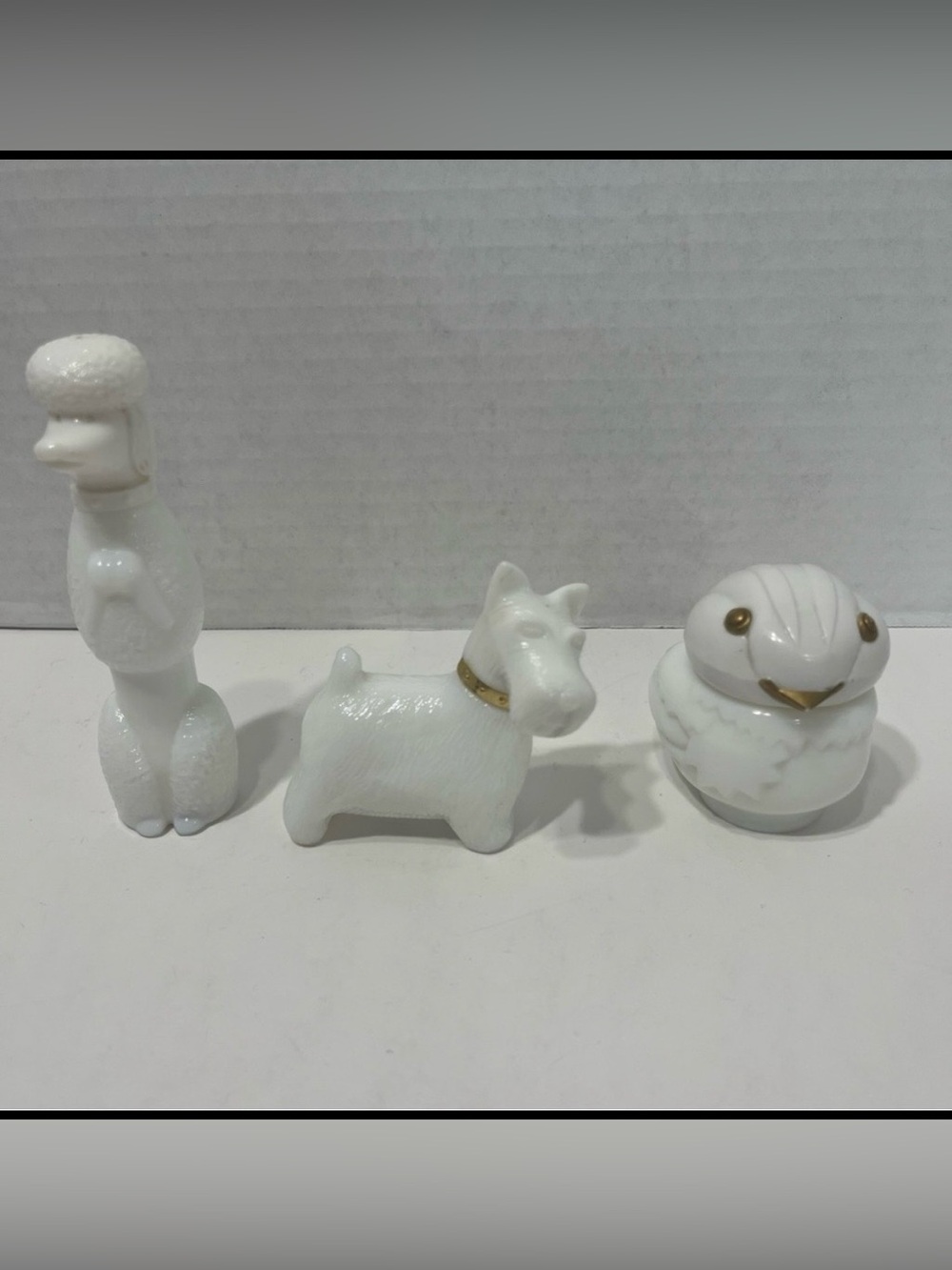 AVON Milk glass poodle and Scottie dog perfume bottles and bird cream sachett